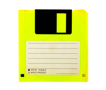 Yellow floppy disk with blank label on white background. Magnetic means of storing information.