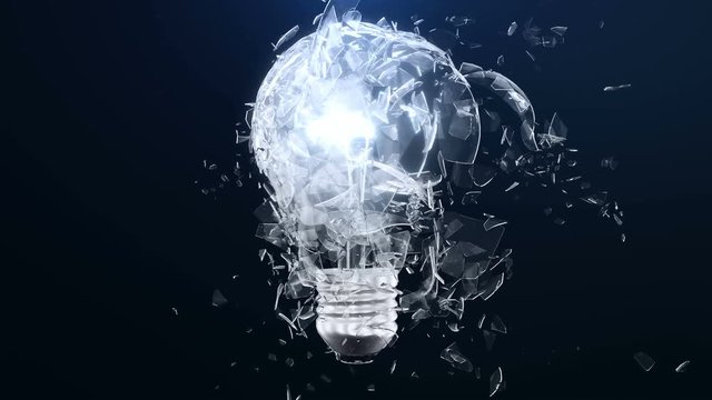 Explosion of an incandescent lamp or ligh bulb. Small pieces of glass fly apart in different directions. The effect of slowing down the time after the explosion. Problem solving concept.
