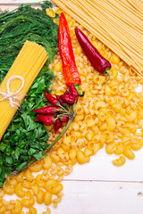 variety of italian pasta, Spaghetti, pipe rigate, cavatappi, herbs, garlic, pepper and tomatoes...
