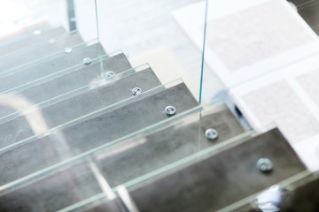 Glass staircase inside modern business center or some other public or educational institution