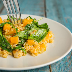 Vegan plate with bulgur and pumpkin.