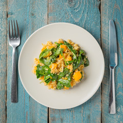 Vegan plate with bulgur and pumpkin.