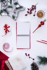 Top view of white table , beautiful Christmas accessories, warm coat and cocoa with marshmallows