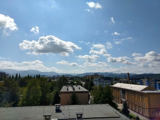 Fototapeta premium Sunrise and sunset over the hills and town. Slovakia