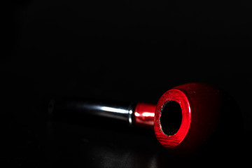 A briar pipe from the side