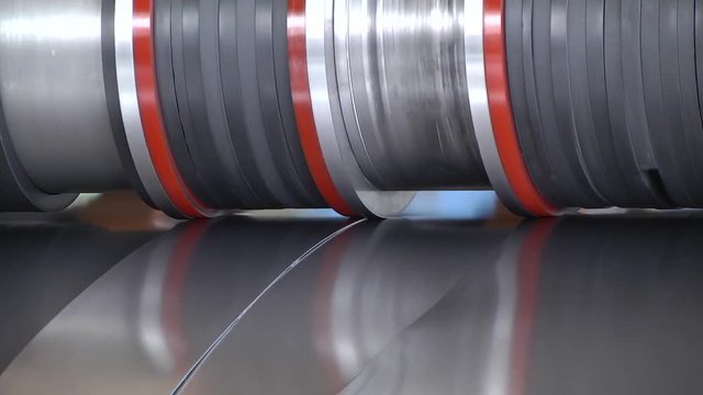 Sheet metal cutting machine for the production of steel pipes. machine for slitting steel sheet. Industrial machine for steel coils cut.