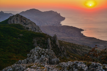 Sunset in the mountains on the sea coast