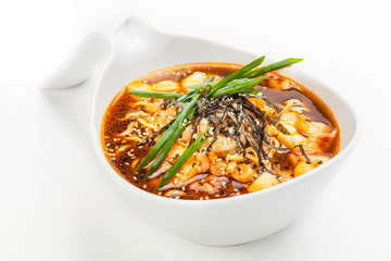 Miso soup in white bowl.
