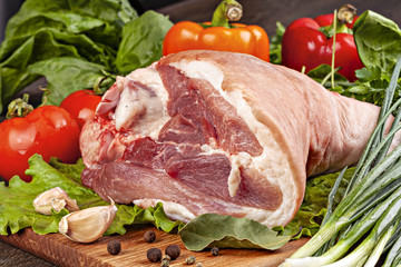 Row pork shank for cooking  with vegetables, spices and herbs.