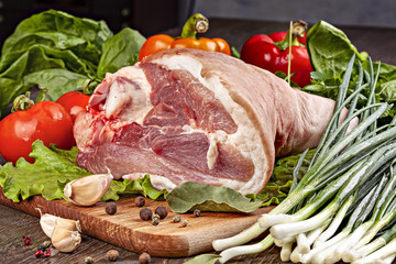 Row pork shank for cooking  with vegetables, spices and herbs.
