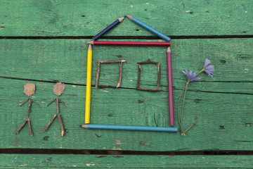 the child draw picture with colorful pens and flowers on the wooden green table in the nursery or school for activity concept. creative ideas for child development.back to school.