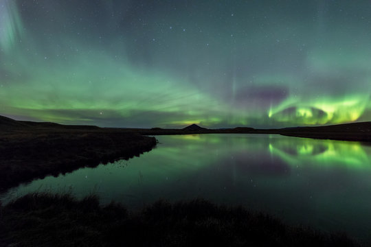 Aurora Borealis reflection in Lake Myvatn in Iceland