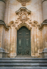 Ornate door to the Duomo of San Giorgio in Modica, fine example of sicilian baroque art. Sicily,...
