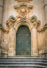 Ornate door to the Duomo of San Giorgio in Modica, fine example of sicilian baroque art. Sicily, southern Italy.