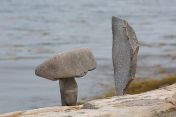 Fototapeta na wymiar Granite Stones shaped as Hammer and Chisel stacked near the beach