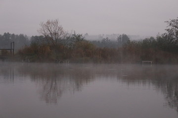 Foggy sunrise on an autumn lake