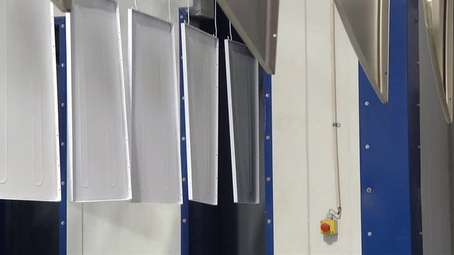 Automatic powder coating line. Powder coating of metal parts. Powder coating of metal parts with thermal polymerization paint.
