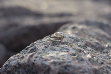 Wedding rings on stone