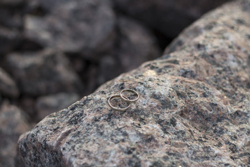 Wedding rings on stone