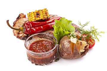 Piece of baked meat with corn, hot pepper and red sauce.