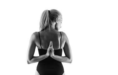 Young blonde woman in maillot practicing yoga lesson