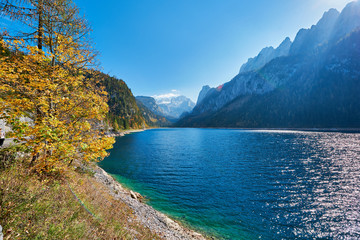 Colorful autumn landscape with mountains, lake and trees in Austrian Alps. Salzkammergut, Gosausee