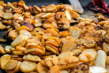 potato slices fried on the tray outside