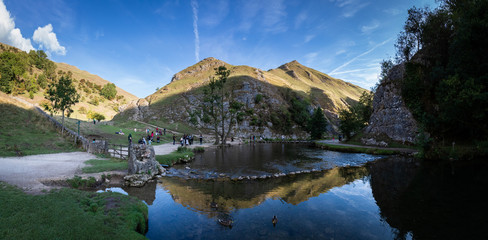 Panorama Tourists enjoying the view and hike at Dovedale Stepping stones, Ilam, Ashbourne,...
