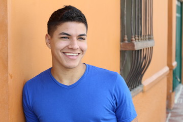 Good looking ethnic young male smiling with copy space