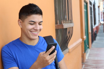 Young ethnic man using a cellphone