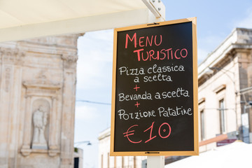 Fototapeta na wymiar Menu for tourists on a blackboard in Apulia