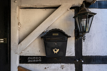 Old lantern and mailbox on the wall.