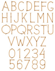 Alphabet and numbers made of golden nails on white background