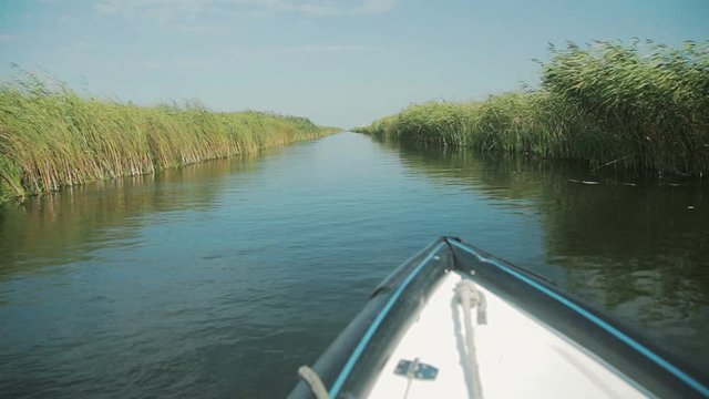 Landscape with waterline and boat from Letea village, in the Danube Delta area, Romania. Danube delta is the second largest river delta in Europe.