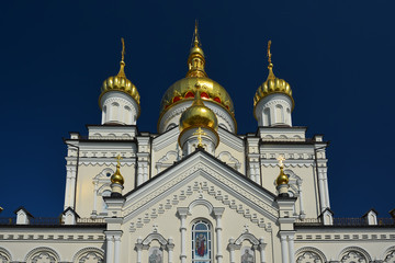 Obraz premium Religious building, Orthodox Christian cathedral with golden domes. Transfiguration Cathedral, Holy Dormition Pochayiv Lavra in Ukraine.