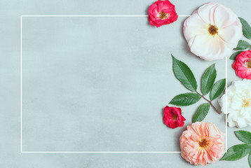 Festive flower composition on gray background. Top view. Overhead