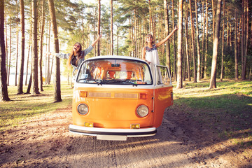 Hipster friends on road trip on a summers day