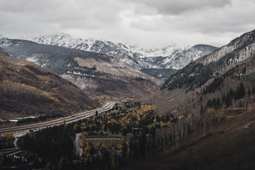 Landscape view of East Vail with the Gore Range in the background after an autumn snow storm. 