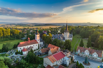 Bozkow palace and church on the panorama of sudety mountains aerial view