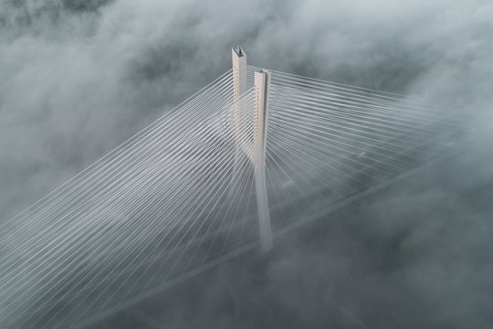 Fototapeta Redzinski bridge in the clouds aerial view