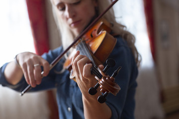 Violin player violinist classical music playing. Orchestra musical instruments