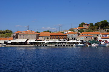 Fototapeta premium Restaurants in the Harbour of Molivos on Lesbos, Greece