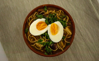 Bowl of vegetarian ramen soup with eggs