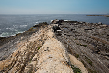 Fototapeta na wymiar Rock ledges at Pemaquid Point, Maine, USA
