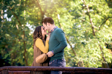 Beautiful love couple hugging and kissing in park