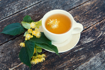 linden flowers herbal  Cup of healthy tea with honey. alternative or complementary medicine, traditional medicine. soft focus image 