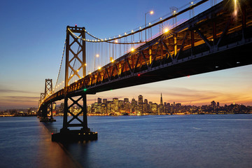 Fototapeta na wymiar San Francisco Bay Bridge stretches across the bay