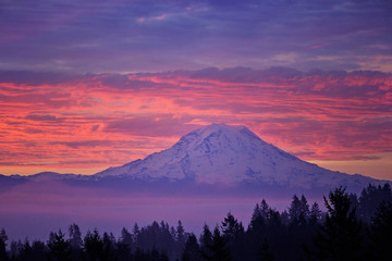 Mt Rainier in Washington State all lit up with the morning sunrise