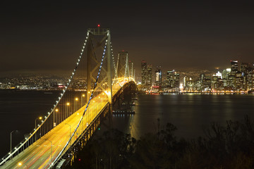 Bay Bridge in San Francisco light up with evening commuters
