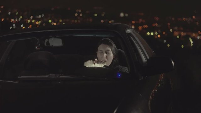 portrait young woman driver yawning and wants to sleep in the car